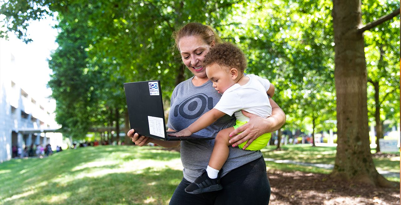 Woman and baby with new laptop